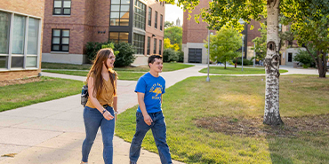 Students walking on campus Students walking on campus